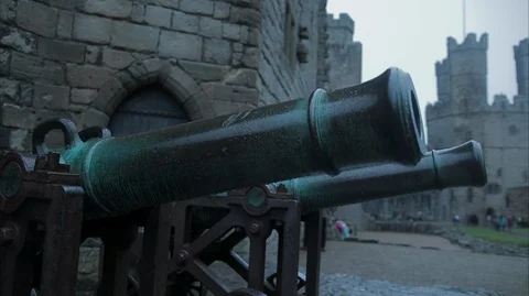 Two canons close up in the courtyard of a Castle Stock Footage 128605585