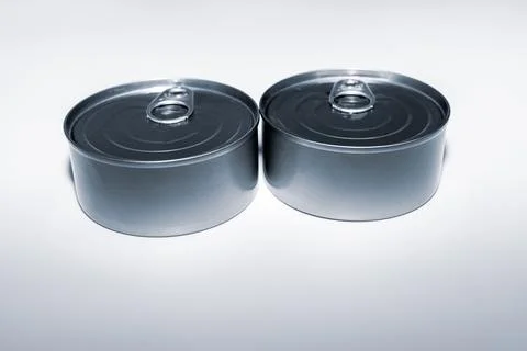 Two cans of fish on white background. Stock Photos