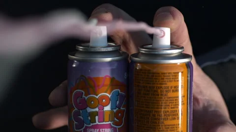 Two cans of silly string shoot in slow motion Stock Footage 62344542