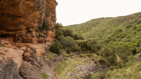 Two Canyoning group walking to the access points of their tours -wide shot Stock Footage 98219408