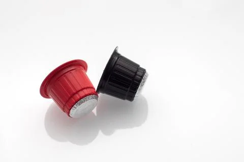 Two capsules for a capsule coffee machine Stock Photos