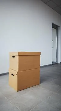 Two cardboard boxes made of brown corrugated cardboard at new home or office Stock Photos