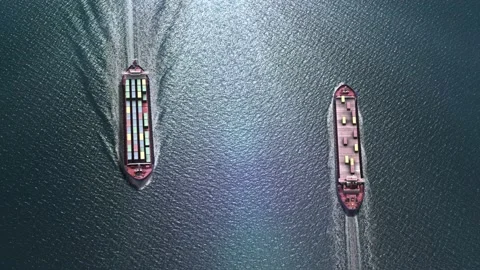 Two cargo ships sailing close in the ocean Stockbeeldmateriaal 143622386