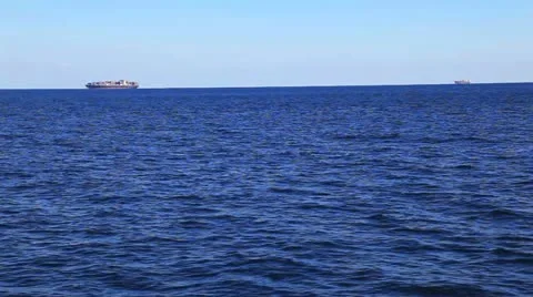 Two cargo ships sailing in the suez canal in the red sea 動画素材 22638077