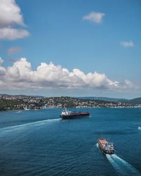 Two cargo ships sailing through the Bosphorus Strait in Istanbul Stock Photos