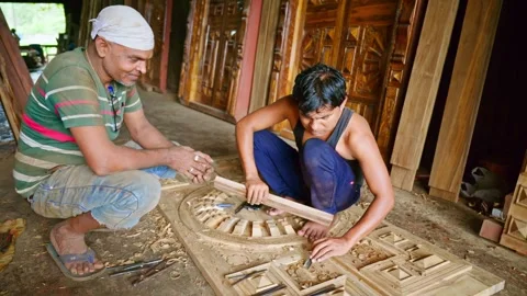 Two carpenter crafting panel edges at workshop Stock Footage 310717642