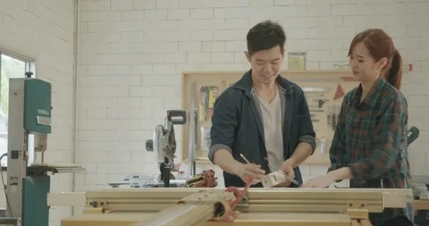 Two carpenter teamwork building design wood house model measure scale Stock Footage 126433655