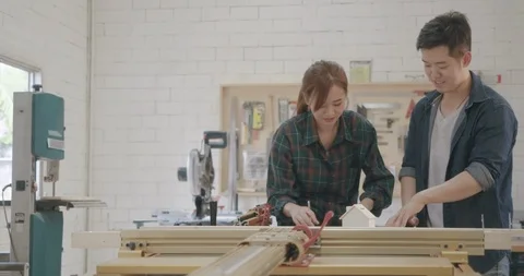 Two carpenter teamwork building design wood house model measure scale size Stock Footage 126441649