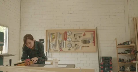 Two carpenter teamwork male and female reading blueprint building design Video stock 126441553