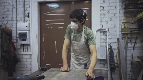 Two carpenters discuss wood blanks in the workshop Stock Footage 102785053