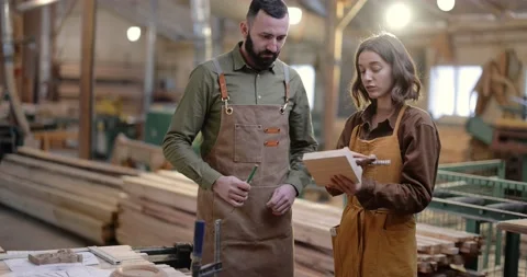 Two carpentry workers at the manufacturing Stock Footage 146920351