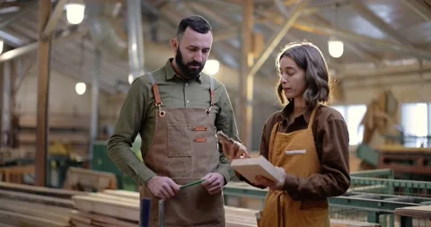 Two carpentry workers at the manufacturing Stock Footage 146921307