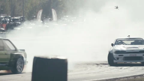 Two cars drift side by side in race comp... | Stock Video | Pond5