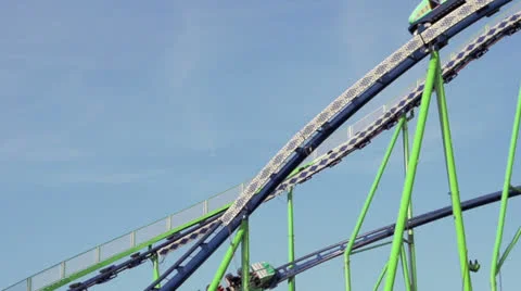 Two cars on a funfair rollercoaster Stock Footage 22676594