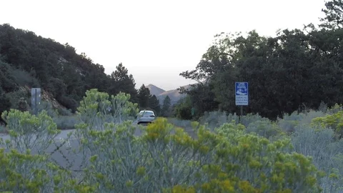Two cars going down the mountain in Hualapai State Park northern Arizona         스톡 동영상 80745719