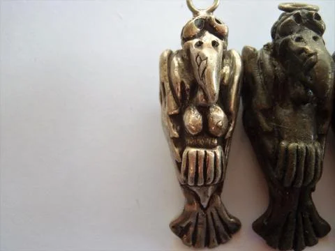 Two Cast silver brass and bronze vultures Stock Photos