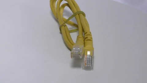 Two cat5 heads and connectors on white surface Video stock 111887708