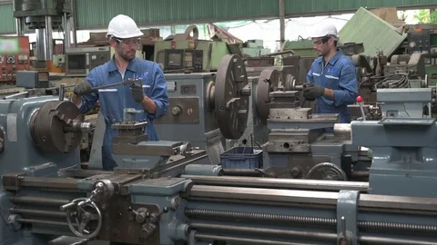Two Caucasian male worker engineer working in factory area line up. Stock Footage 125942865