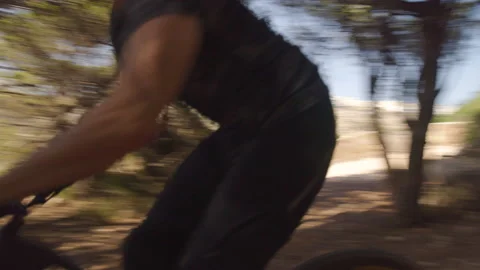 Two Caucasian Men Biking Down Hill In Nature Stock Footage 139756595
