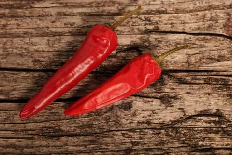 Two cayenne or red hot chilli peppers Stock Photos