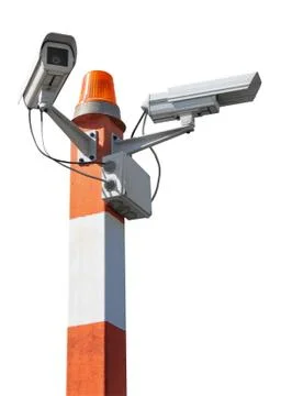Two CCTV security cameras on red striped pillar with orange flashing light. I Stock Photos