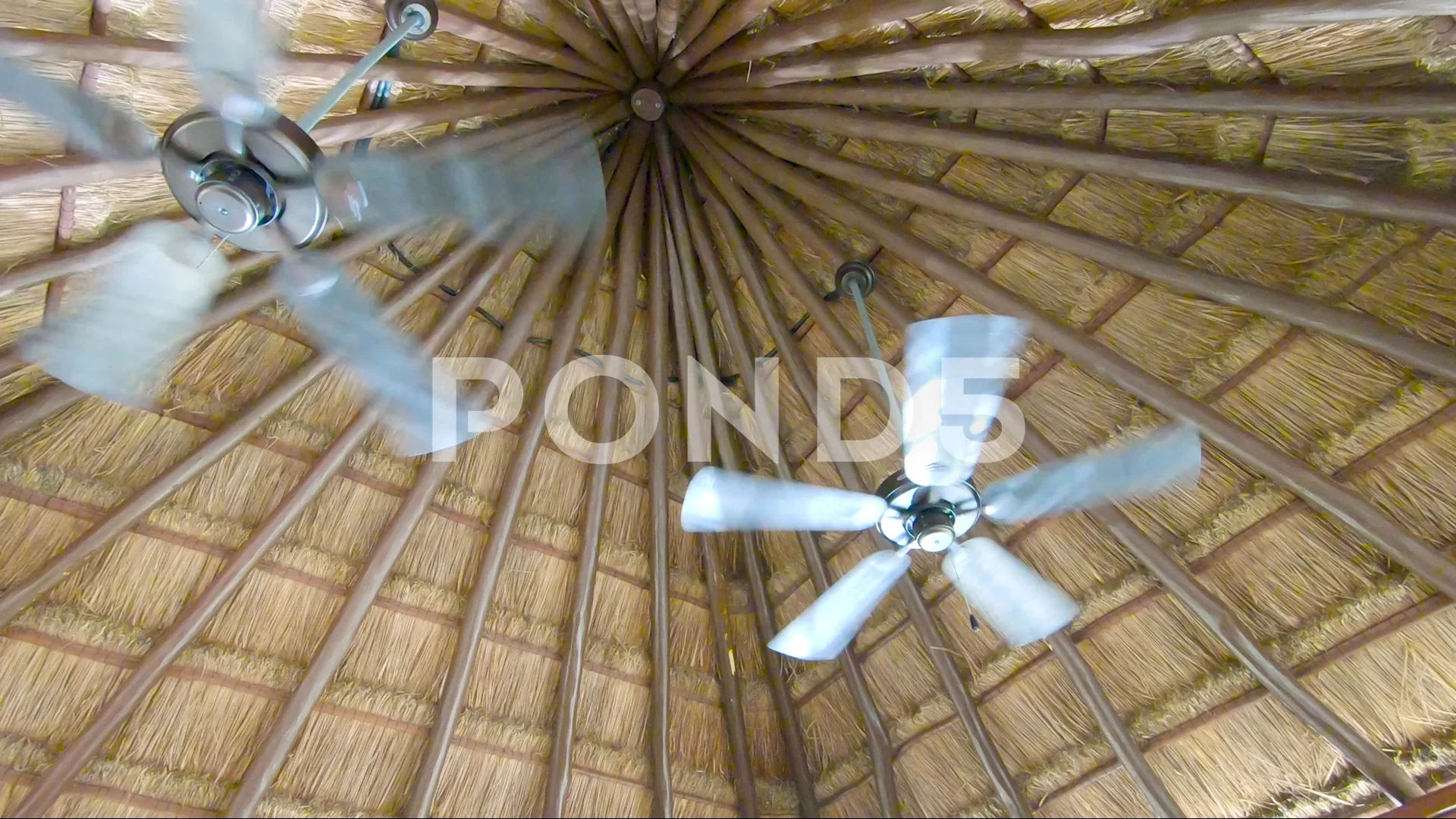 Two Ceiling Fans Spinning Fast At A Spa
