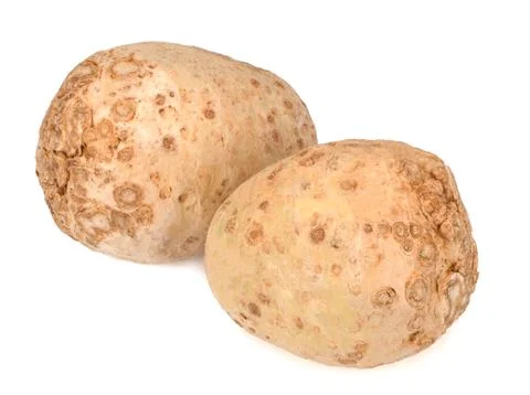 Two celery roots isolated on white background. Close-up. Stock Photos