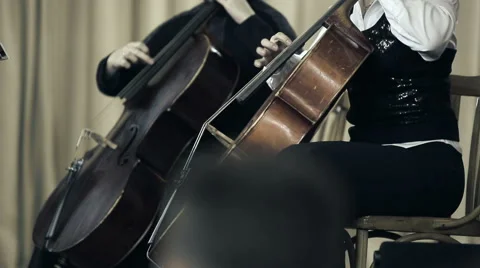 Two cellist playing fingers on cello at the concert Stock Footage 45200147