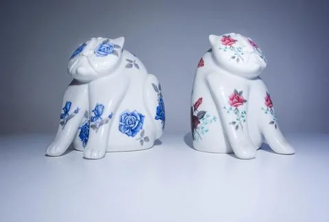 Two Ceramic Cats on a White Background Stock Photos