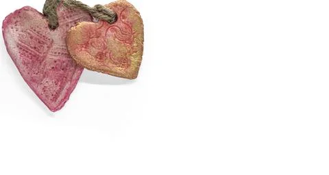 Two ceramic hearts on a white background copy space 스톡 사진