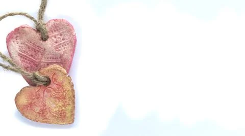 Two ceramic hearts on a white background copy space Stock Photos