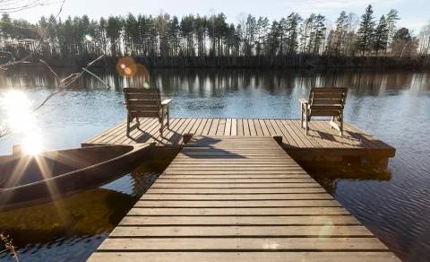 Two Chairs on Pier in River Stock Photos
