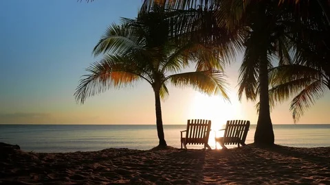 Two Chairs Placed in the Sand Stock Footage 73999236