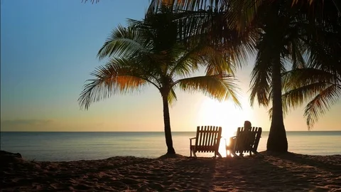 Two Chairs Placed in the Sand Stock Footage 74002162