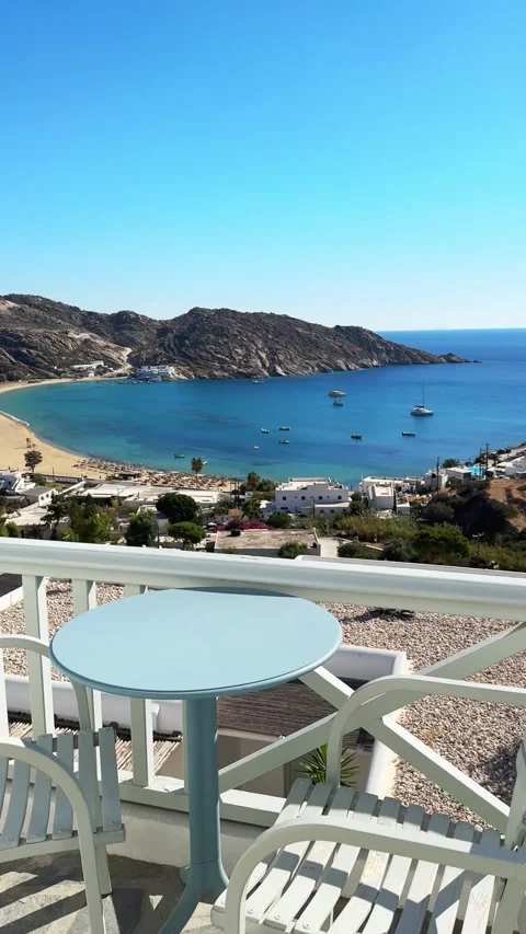 Two chairs with table on the terrace with sea view. Ios island, Greece Video stock 300773098