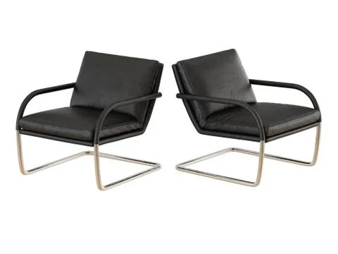 Two chairs worn black leather on a metal base on a white background 3d render Stock Illustration