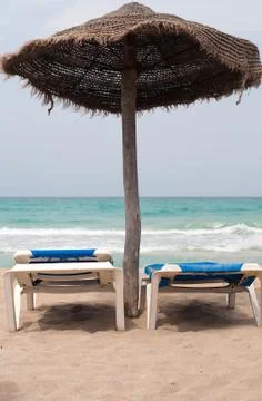 Two chaise longes on the beach 写真素材