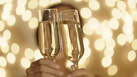 Two champagne glasses and out of focus female portrait on the background Stock Footage 72370491