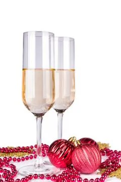 Two champagne glasses on light background. Stock Photos