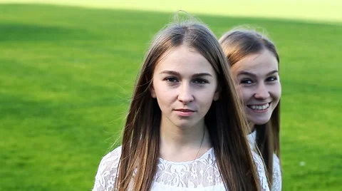 Two charming sisters emotional twins Stock Footage