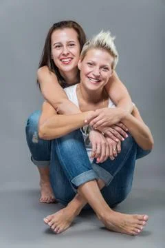 Two cheerful sisters having fun in the studio. Stock Photos