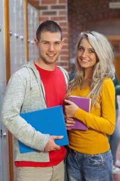 Two cheerful students looking at camera Stock Photos