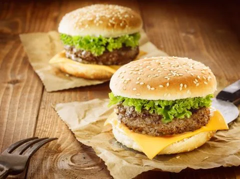 Two cheeseburger with meat, cheese and salad Stock Photos