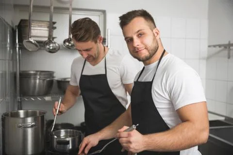 Two chef cooking together Stock Photos