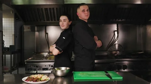 Two chefs are cooking a dish in the restaurant kitchen. Stock Footage 236506796