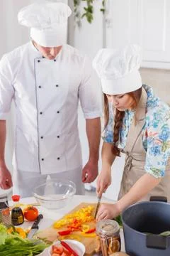Two chefs are working together. Stock Photos