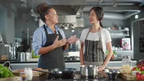 Two Chefs Cooking Talking Stock-Footage 169477997