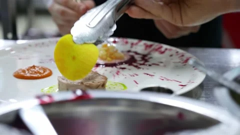 Two chefs decorates the appetizer at restaurant kitchen before dish up it Stock Footage 152214977