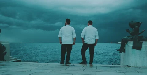 Two chefs have a conversation by the water Stock Footage 204973603