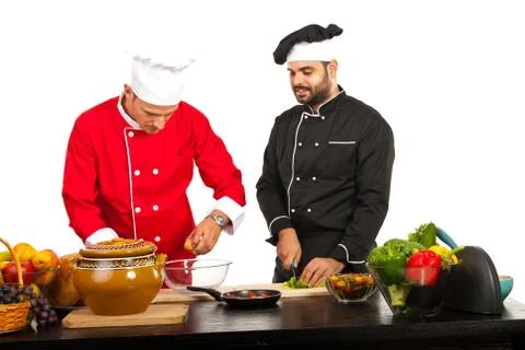 Two chefs preparing food Fotos Stock